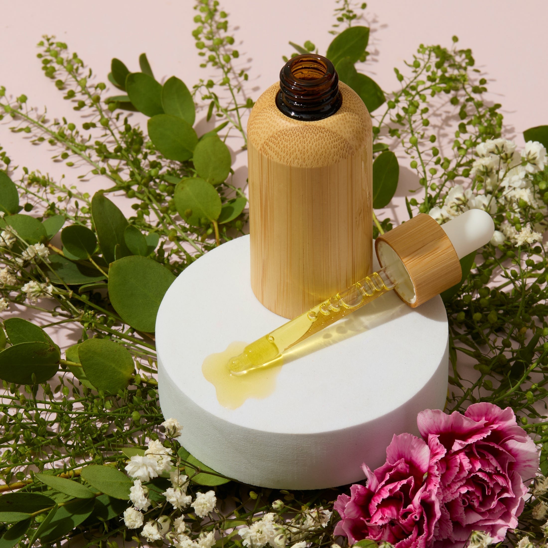 Cuticle oil in a bamboo bottle with dropper