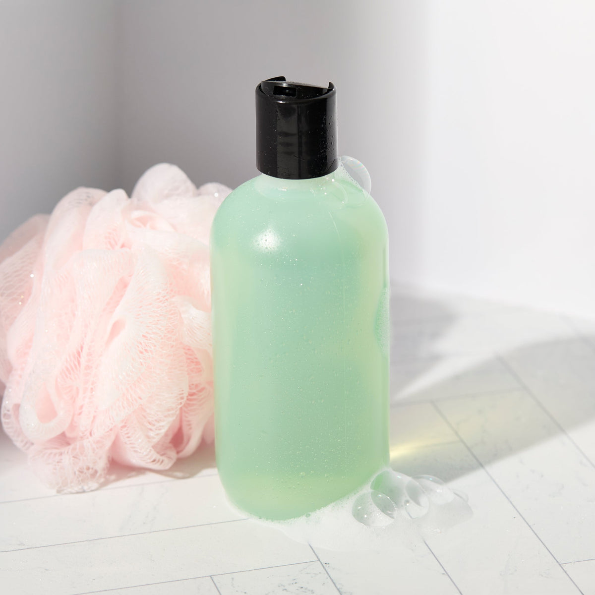basic body wash next to loofah