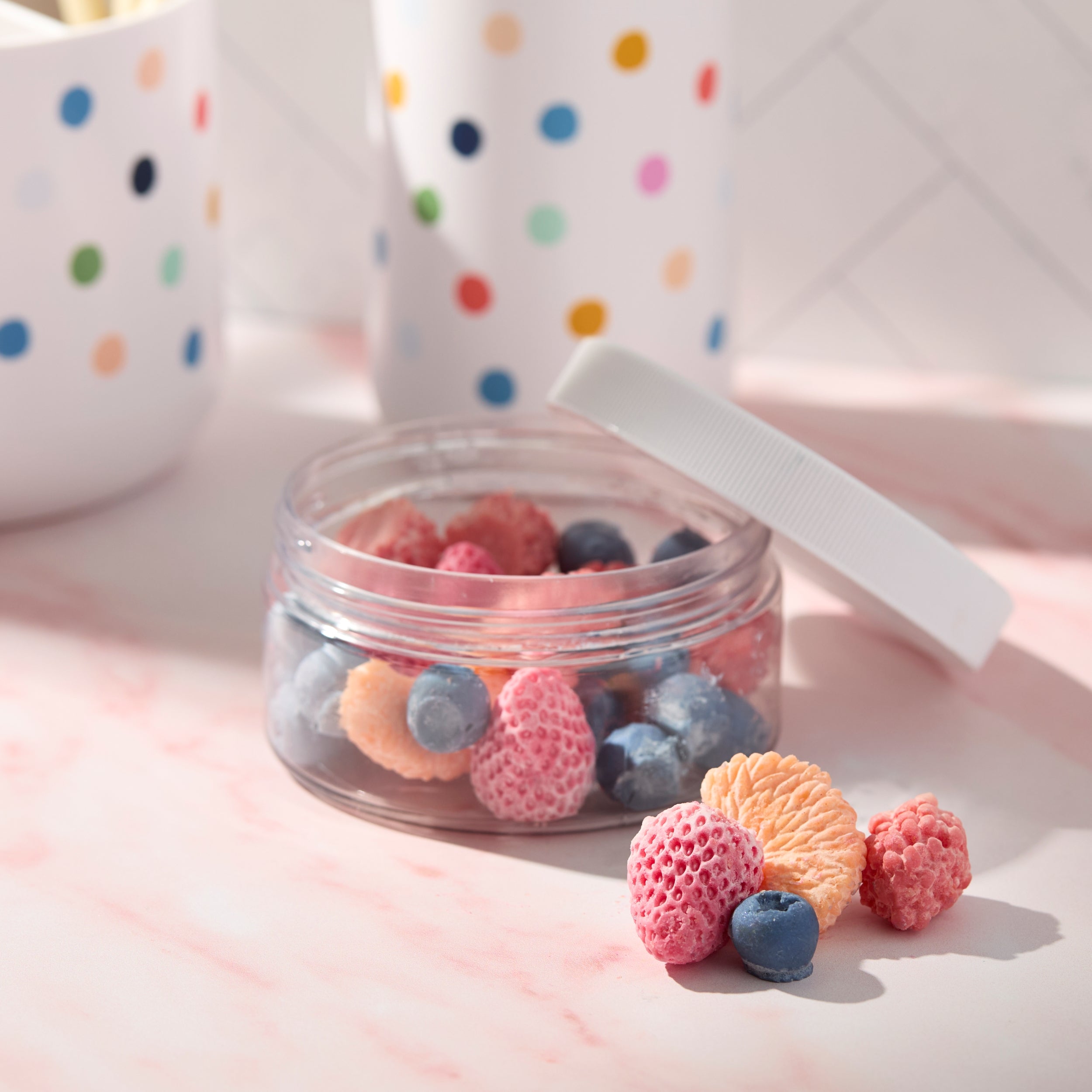 solid lotion in fruit shapes in a jar